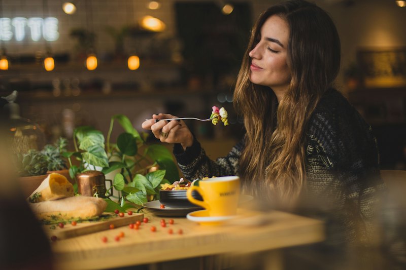 Sample photo: a guest enjoying a meal in warm afternoon light